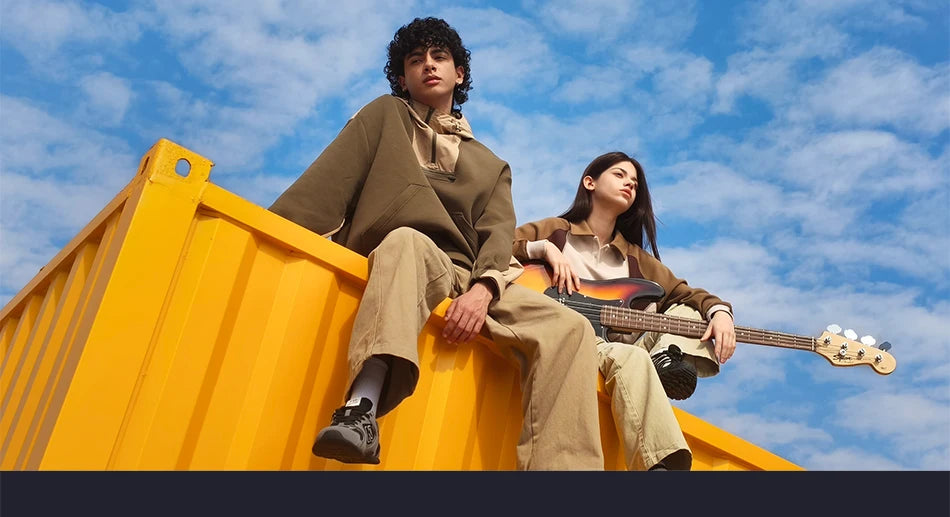 Two young people sit on a bright yellow structure against a blue sky, promoting the Global Version POCO X8 Pro Smartphone MTK Dimensity 8500-Ultra 6500mAh Battery 6.59" 1.5K 120Hz AMOLED Display 50MP Camera with a modern, stylish vibe.